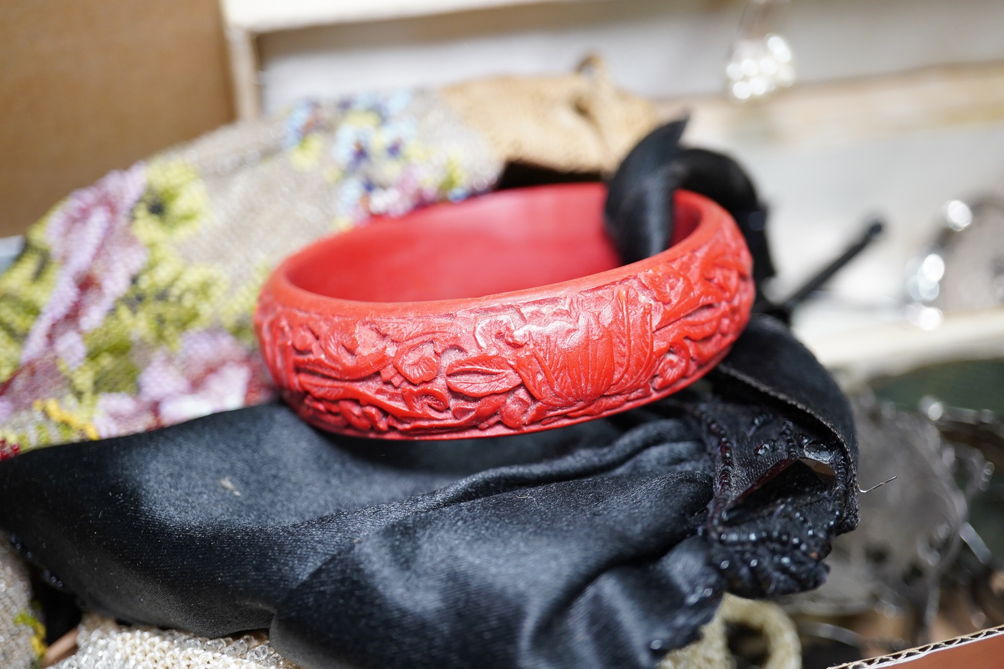 A silver plated ornate lady's belt, various items of costume jewellery, two beaded evening bags and a black jet mounted bag. Condition - varies